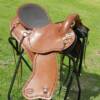 This saddle was made for Cal from Kamloops BC.  Made on a 16 inch ralide tree, covered with brown skirting and barbed wire border stamped. Fitted with solid brass hardware and texas star concho’s. The padded seat is covered in smooth out, top grain leather.

