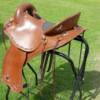 This saddle was made for Cal from Kamloops BC.  Made on a 16 inch ralide tree, covered with brown skirting and barbed wire border stamped. Fitted with solid brass hardware and texas star concho’s. The padded seat is covered in smooth out, top grain leather.

