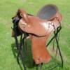 This saddle was made for Cal from Kamloops BC.  Made on a 16 inch ralide tree, covered with brown skirting and barbed wire border stamped. Fitted with solid brass hardware and texas star concho’s. The padded seat is covered in smooth out, top grain leather.

